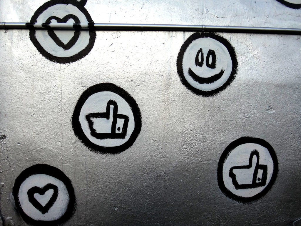 social icons and emojis graffiti on wall