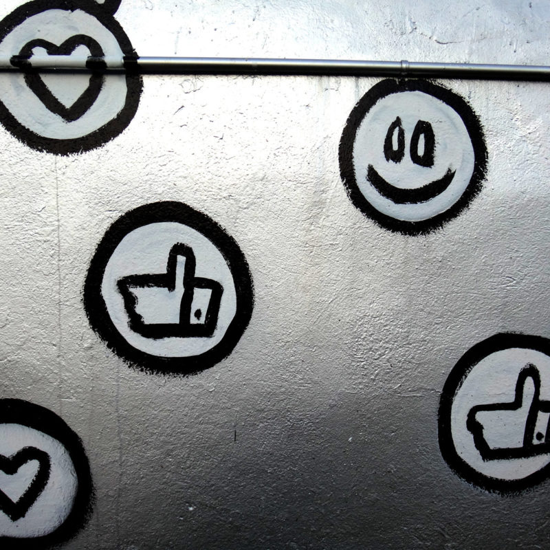 social icons and emojis graffiti on wall